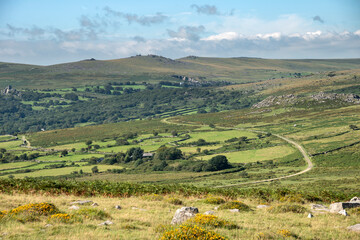 Panoramic landscape view across Dartmoor National Park in Summer with wide views of several tors and valleys © veneratio