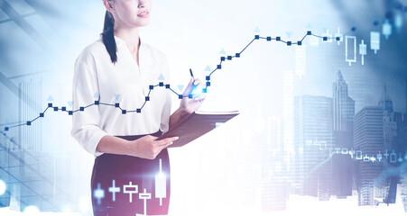 Woman with clipboard in city, graph