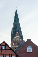 Fototapeta na wymiar historic old red brick buildings and church steeple in Lunenburg