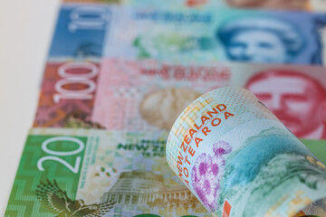 New Zealand money, Banknotes of different values spread out on a table, vertical photo