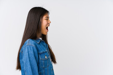 Young asian woman shouting towards a copy space