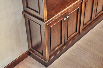 Wooden bookcase with empty shelves in home library