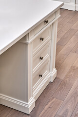 White wooden classic desk with drawers in home office