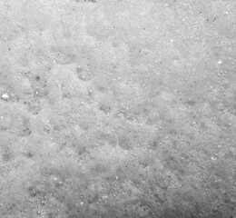 Stack of foam on the shore of Lake accumulated torrential waves