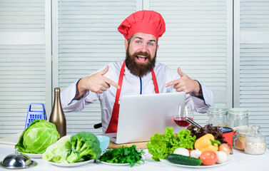 Happy bearded man. chef recipe. Cuisine culinary. Vitamin. Dieting organic food. Vegetarian salad with fresh vegetables. Healthy food cooking. Mature hipster with beard. Cool and confident