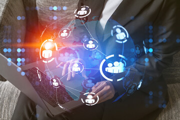 Multi exposure of woman works on computer background and people icon network hologram. Concept of...