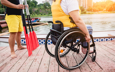 Obraz premium People with disabilities in life vests on the pier.