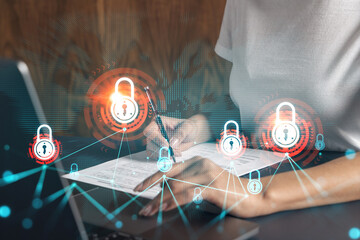 Businesswoman typing laptop and lock drawing. Concept of security of information and business data....