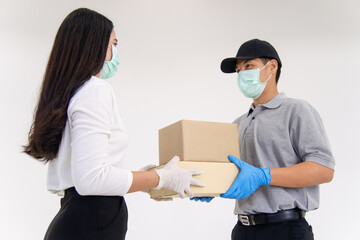 Delivery man bring parcel to customer by wearing surgical mask and gloves