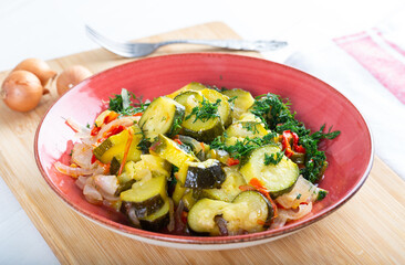 Zucchini Salad in dish on table. Fresh summer salad.