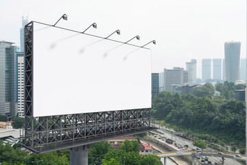 Blank white road billboard with KL cityscape background at day time. Street advertising poster, mock up, 3D rendering. Side view. The concept of marketing communication to promote or sell idea.