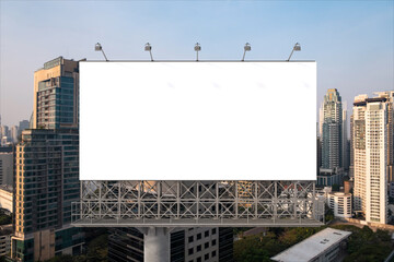 Blank white road billboard with Bangkok cityscape background at sunset. Street advertising poster, mock up, 3D rendering. Front view. The concept of marketing communication to promote or sell idea.