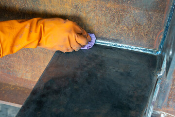 Step to use rag wipe Solvent Remover to cleaning the welded surface before performing spray Liquid...