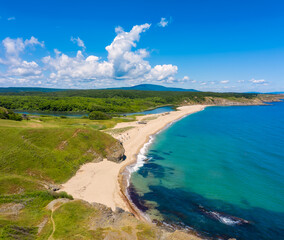 Aerial panoramic view of the wild beaches, surrounded by rocks and green dense forests on the southern Black Sea coast, Bulgaria