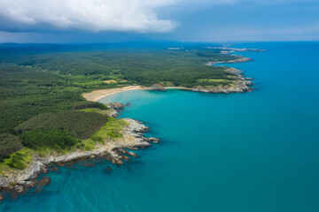 Fototapeta na wymiar Aerial panoramic view of the wild beaches, surrounded by rocks and green dense forests on the southern Black Sea coast, Bulgaria