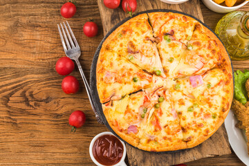 Tasty fresh pizza with seafood on table,