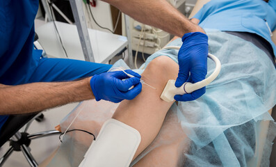 Cardiologist use tubes and ultrasound for radiofrequency catheter ablation.