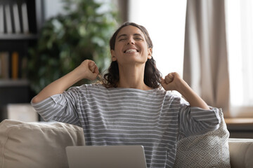 Head shot overjoyed excited young attractive woman received good news message notification on...