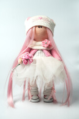 Doll with pink hair with a white cap