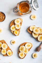 sweet sandwiches for breakfast with banana and pasta and honey top view