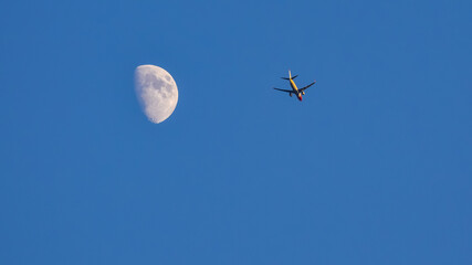 plane flying near the Moon