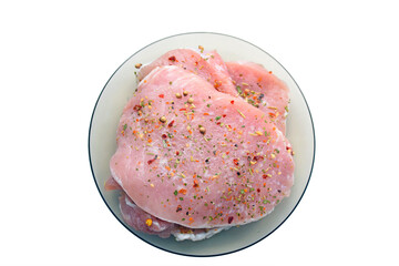 Raw pork meat. Fresh steaks on white plate isolated on white background. Top view, copy spacce for text. Dieting, nutrition