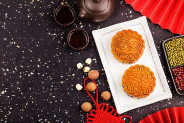 Mid-Autumn Festival concept, Traditional mooncakes on table  with teacup