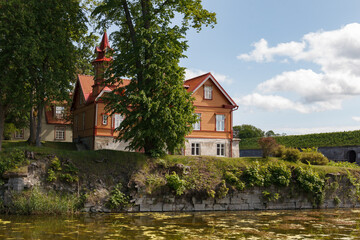 Wooden Houses in front of the Kuressaare Castle on the island Saaremaa, Estonia