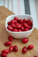 red dogwood berries in a white bowl