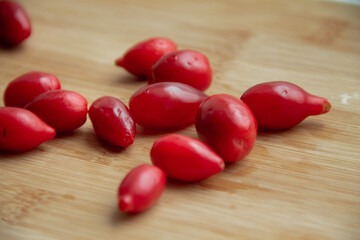 red dogwood berries on a wooden stand