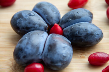 plum fruit in the form of hearts and dogwood berries