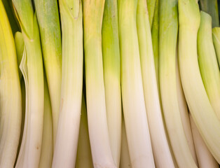 Detail of some delicious leek in bulk in a vertical image