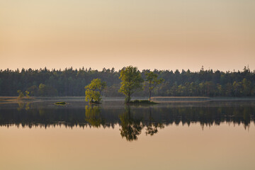 A Tiny Island On A Misty Summer Evening, Sunset Time.