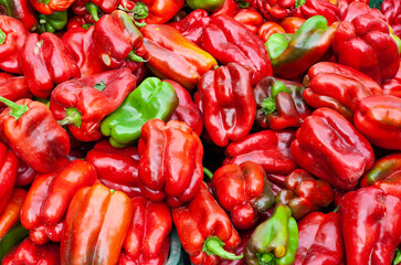 Detail of some delicious red peppers in a street market.