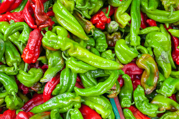 Detail of some delicious geen and red peppers in a street market.