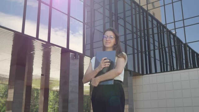 Confident business woman, near office, holding coffee, smiling, independent executive woman enjoying successful corporate career 4k footage
