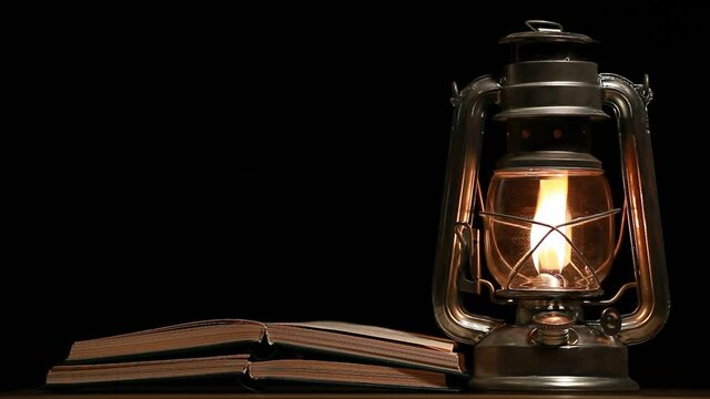 footage of book lamp dark background 