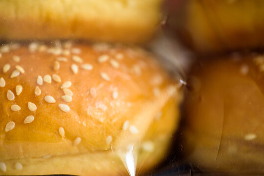 sesame seed bun inside plastic packaging closeup