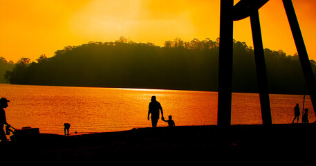 silhouette people in the sunset