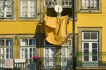 laundry drying on the facades of the Ribeira district on the banks of the Douro in Porto, Portugal