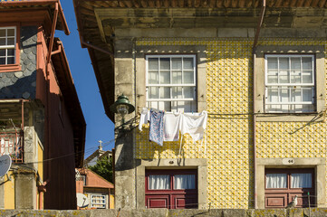 laundry drying on the facades of the Ribeira district on the banks of the Douro in Porto, Portugal