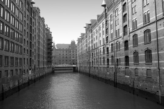 A canal in the Speicherstadt, or warehouse district, in Hamburg Germany