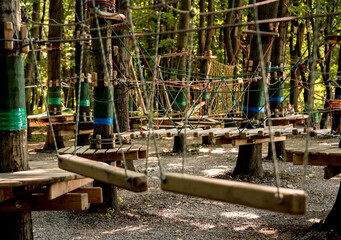 Rope park in a forest. Adventure summer park.