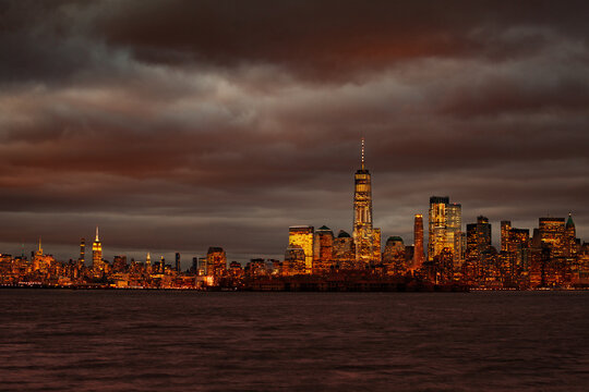 Moody night view of New York Manhattan downtown over Hudson river © Sergey Novikov