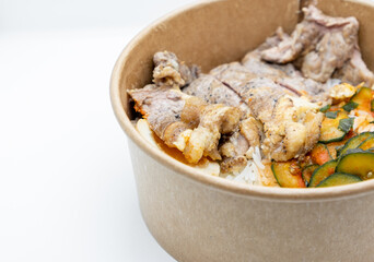 Closed up of take away rice box, lunch box in hard paper bowl on white background