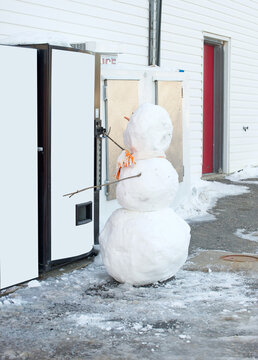 Snowman at soda machine with copy space.