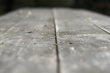 Template with the surface of a wooden table from the boards standing on the street. Soft focus at low depth of field