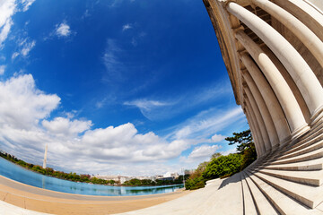 United States Thomas Jefferson Memorial exterior over Washington monument column and Tidal basin