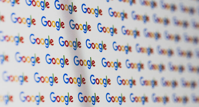 Seamless pattern of Google logo on white background - real macro shot of a computer screen with visible pixels and shallow depth of field - banner background