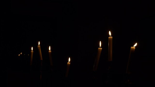 video of wax candles on a dark background